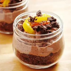 Decadent Dirt Pudding dessert served in a colorful cup with gummy worms